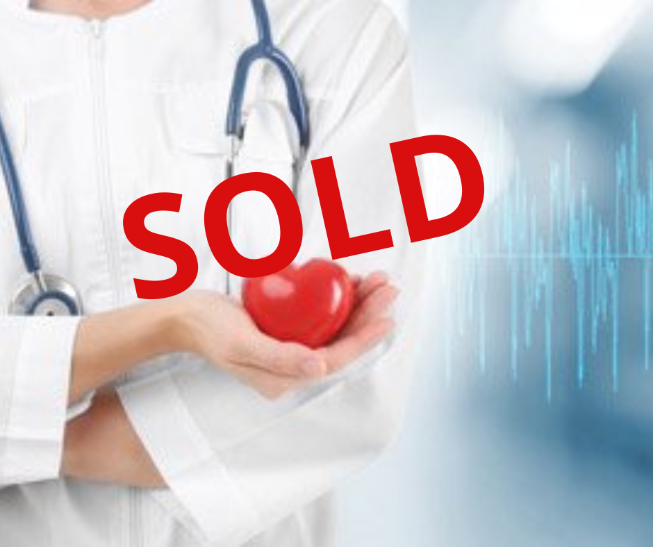 Image of physician holding a heart shape - with the word SOLD over it.