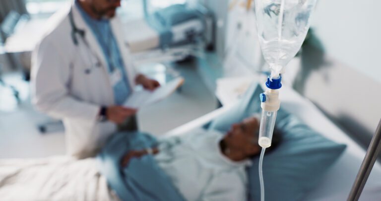 IV drip, healthcare and medicine with doctor and patient in hospital, treatment and surgery with healing